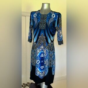 Paisley dress. Knee length (maybe just above😉). Three-quarter length sleeves.